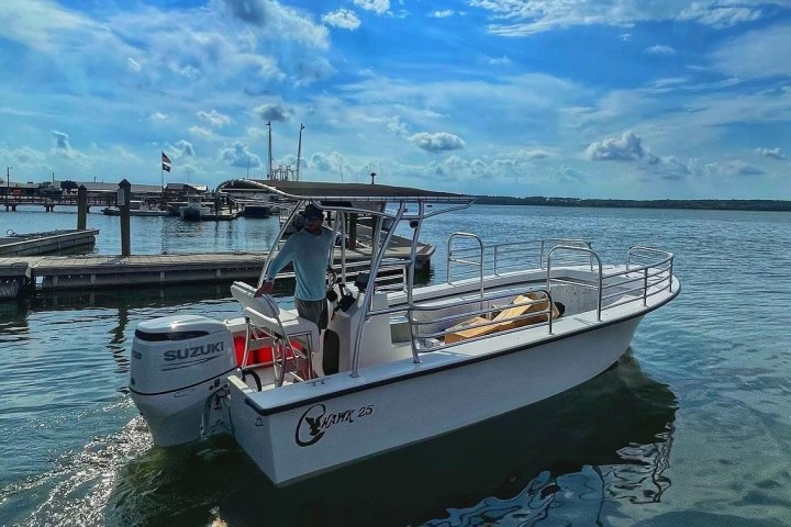 a boat is docked next to a body of water